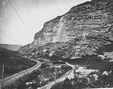 Old photograph of rock wall in canyon